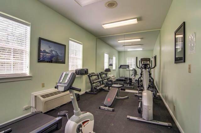 workout area with plenty of natural light and baseboards