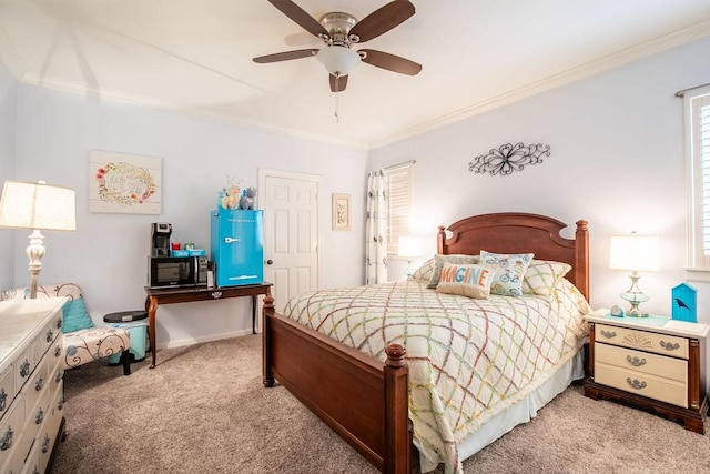 bedroom featuring light carpet, ceiling fan, baseboards, and crown molding