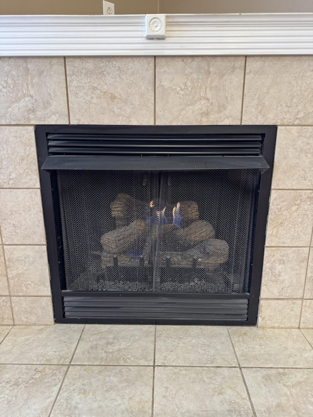 details featuring a tile fireplace