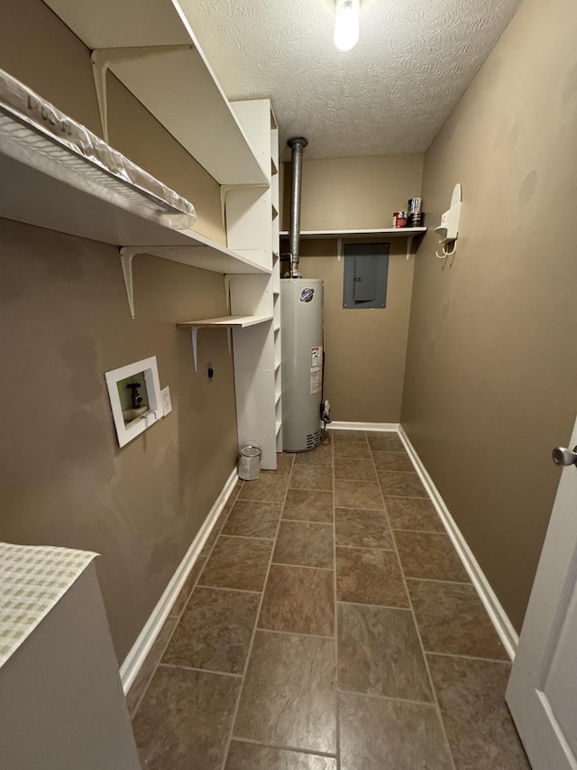 laundry area with gas water heater, hookup for an electric dryer, laundry area, washer hookup, and baseboards