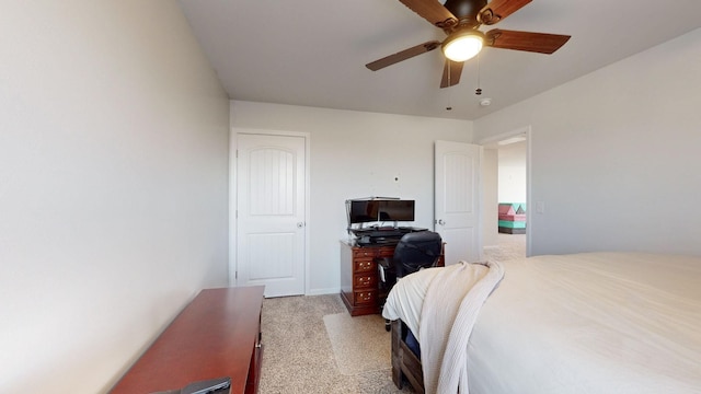 bedroom with ceiling fan and light colored carpet