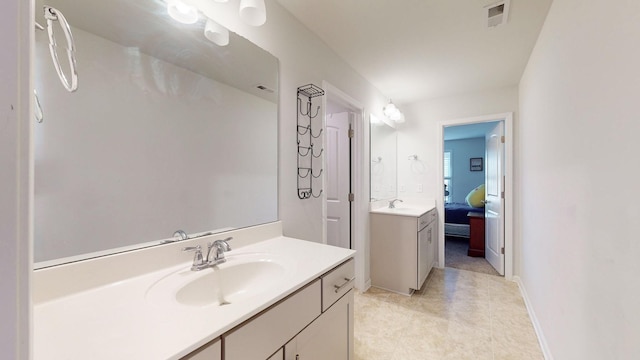 ensuite bathroom featuring a sink, two vanities, connected bathroom, and visible vents