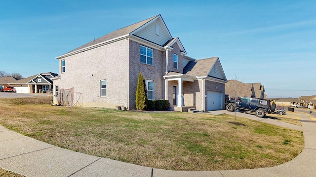 view of side of home with a yard, driveway, brick siding, and an attached garage