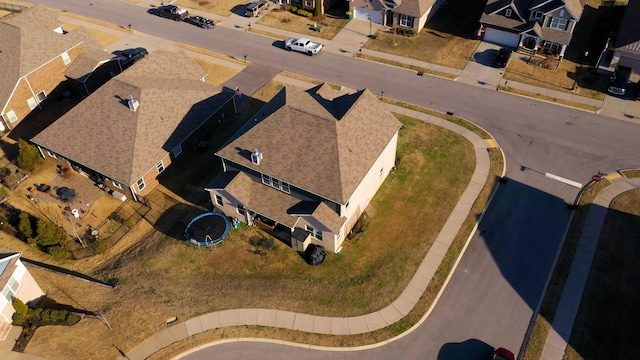 birds eye view of property with a residential view