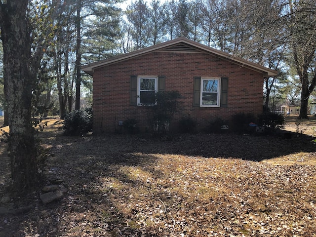 view of home's exterior featuring brick siding