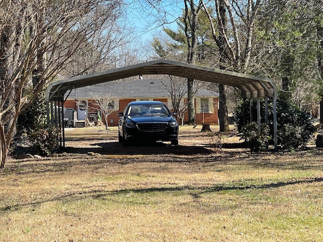 view of parking featuring dirt driveway and a detached carport