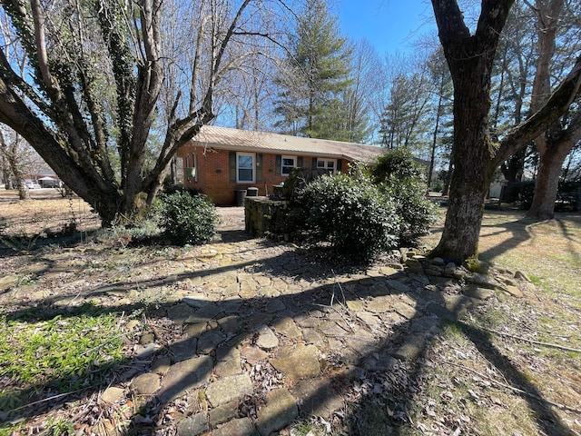 exterior space with brick siding