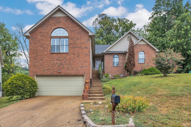 traditional home featuring driveway, a front yard, a garage, and brick siding