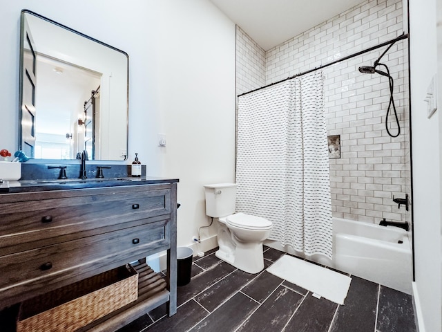 full bathroom featuring shower / bath combo, baseboards, vanity, and toilet