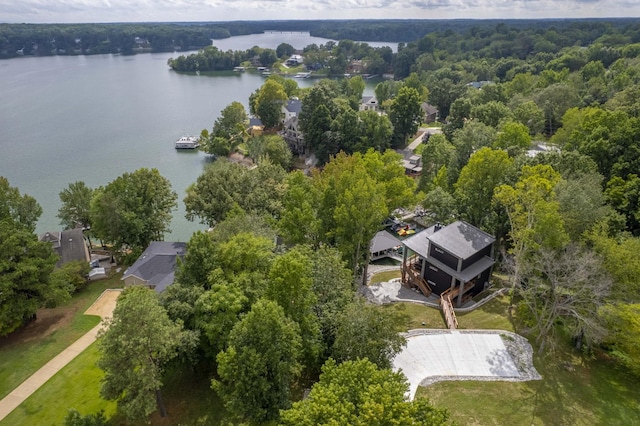 bird's eye view with a water view and a view of trees