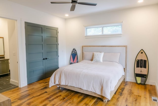 bedroom with light wood-style floors, recessed lighting, and visible vents