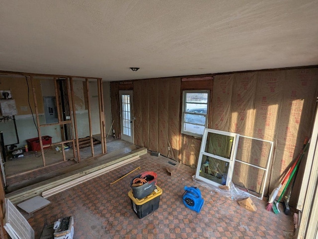 unfurnished living room featuring a textured ceiling