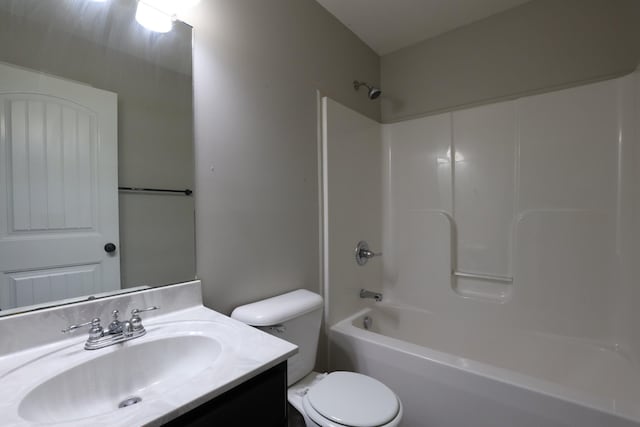 bathroom with toilet, shower / bathtub combination, and vanity