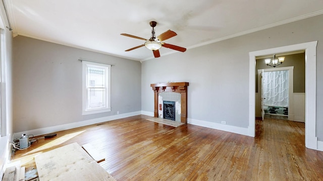 unfurnished living room with a fireplace with flush hearth, wood-type flooring, and crown molding