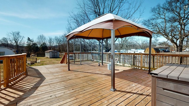 deck featuring a storage shed and an outbuilding