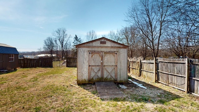 view of shed with a fenced backyard