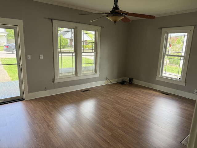 612 W Main St, Watertown, TN 37184 - spare room with baseboards, ornamental molding, visible vents, ceiling fan, and wood finished floors