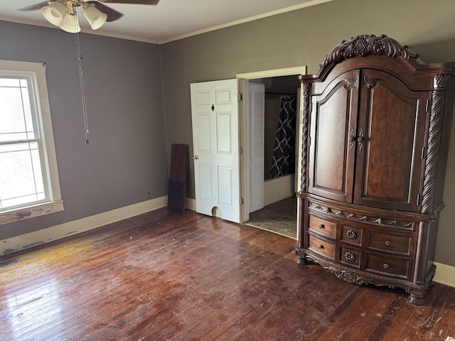 612 W Main St, Watertown, TN 37184 - unfurnished bedroom featuring crown molding, baseboards, and dark wood-style floors