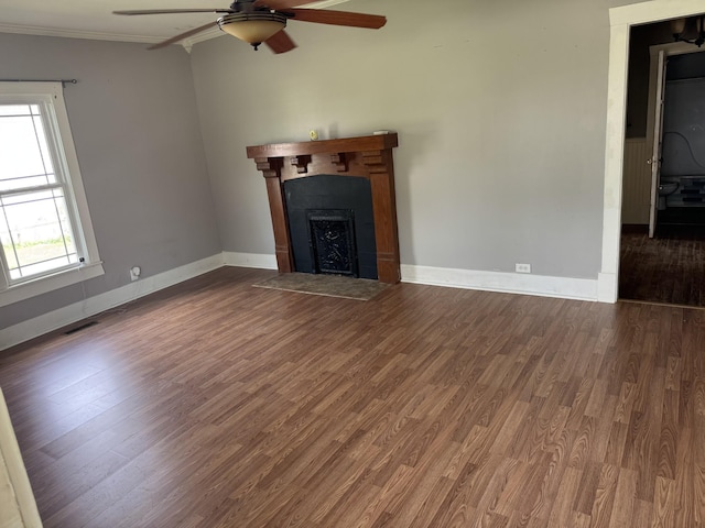 612 W Main St, Watertown, TN 37184 - unfurnished living room with a ceiling fan, visible vents, a fireplace with flush hearth, crown molding, and wood finished floors