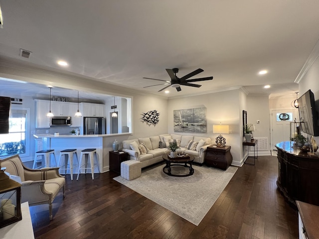 living area featuring dark wood-style floors, ceiling fan, ornamental molding, and recessed lighting