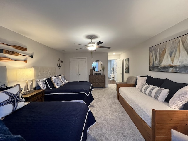 carpeted bedroom featuring ceiling fan