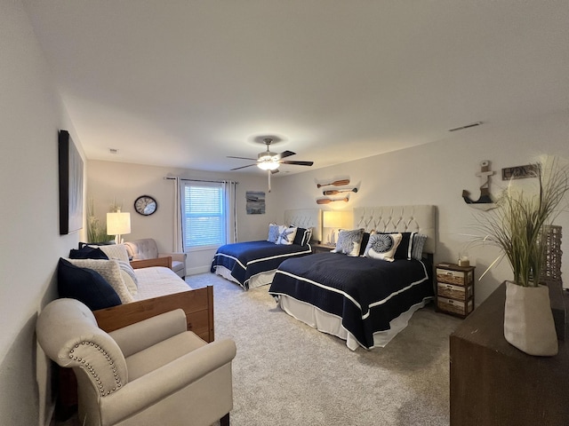 bedroom featuring carpet floors, visible vents, and a ceiling fan