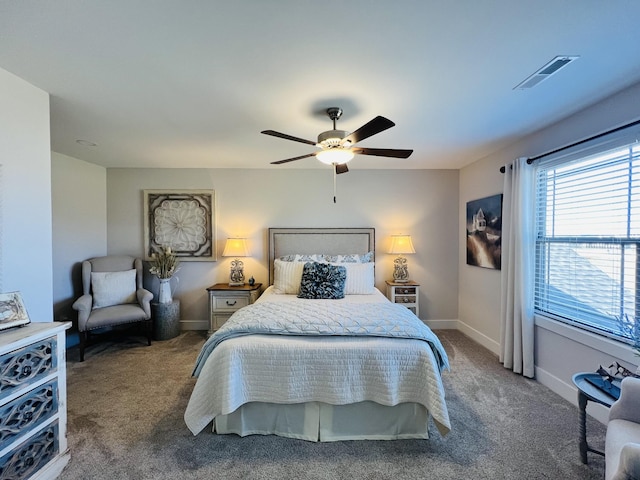 bedroom featuring baseboards, visible vents, ceiling fan, and carpet flooring