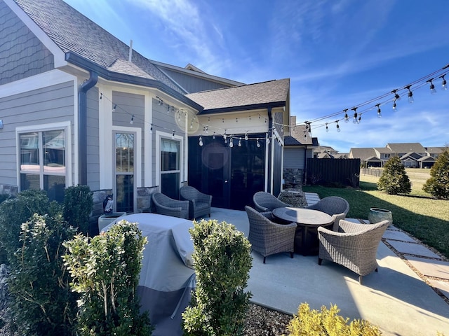 view of patio / terrace featuring outdoor dining area, a grill, and fence