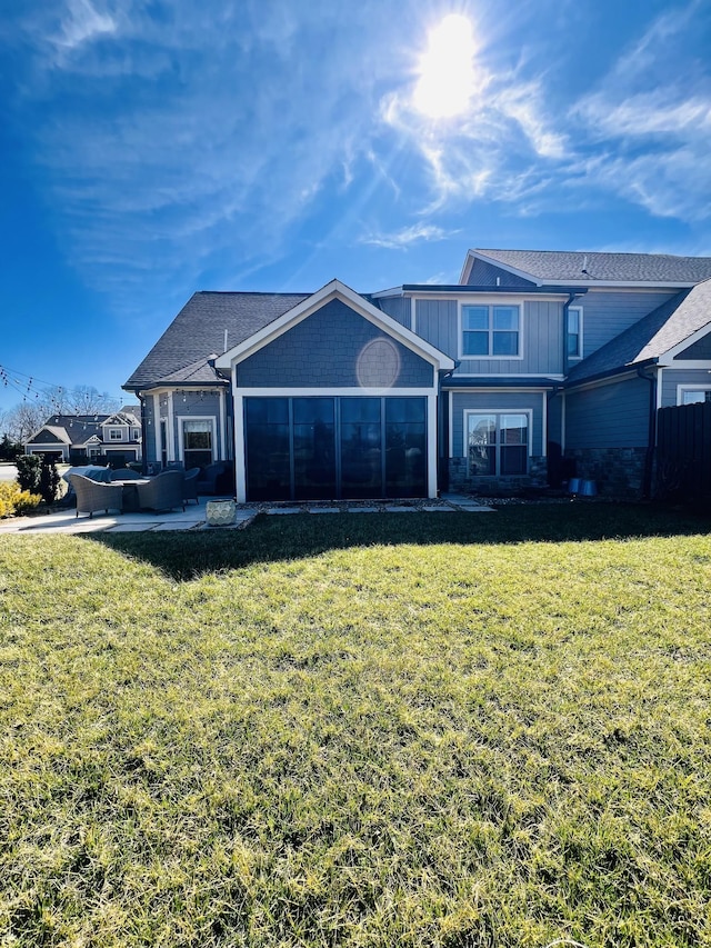 view of front of property featuring a patio area, a front yard, and fence