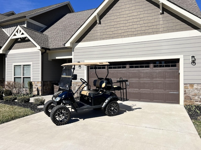 view of home's exterior featuring a garage, stone siding, roof with shingles, and driveway