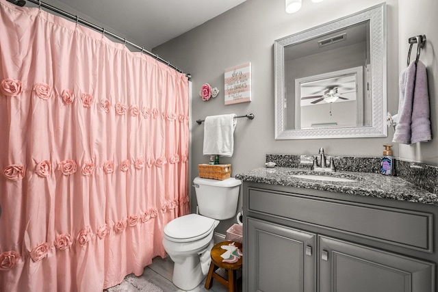 full bath with visible vents, vanity, toilet, and a shower with curtain