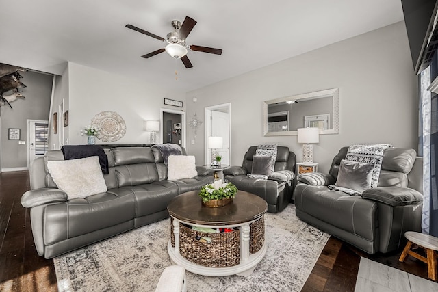 living area with a ceiling fan and wood finished floors