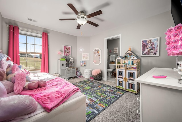 carpeted bedroom with visible vents and a ceiling fan