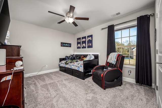 bedroom with carpet, visible vents, ceiling fan, and baseboards