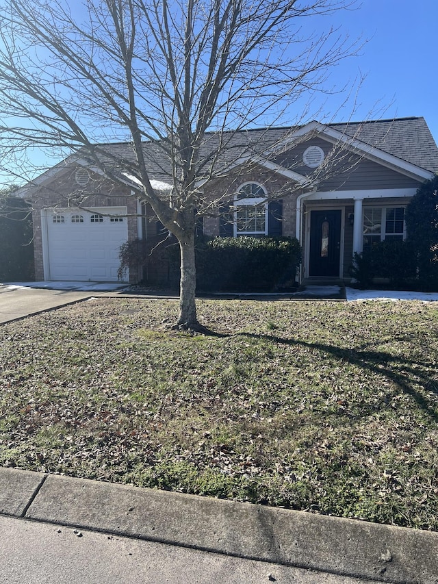 view of front of house featuring driveway and an attached garage