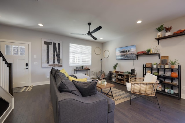 living room featuring dark wood finished floors, recessed lighting, a ceiling fan, baseboards, and stairs