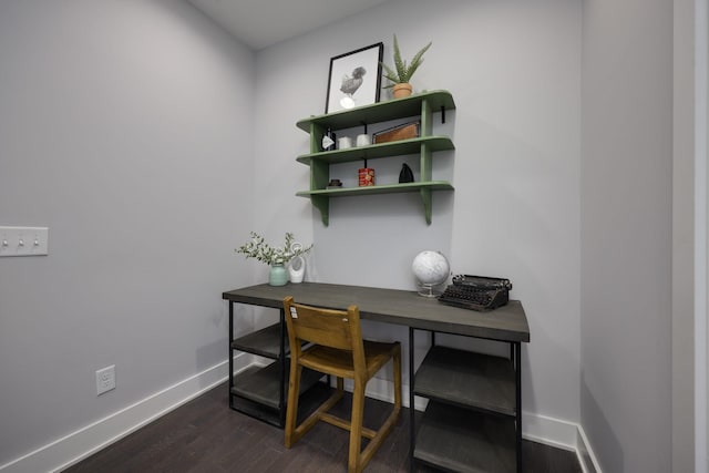 office area featuring dark wood-style flooring and baseboards