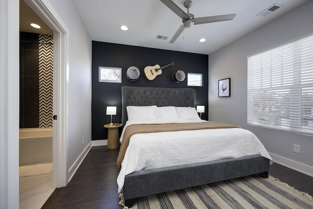 bedroom with dark wood-type flooring, visible vents, and baseboards