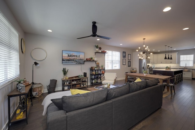 living area featuring dark wood-style floors, a wealth of natural light, baseboards, and recessed lighting