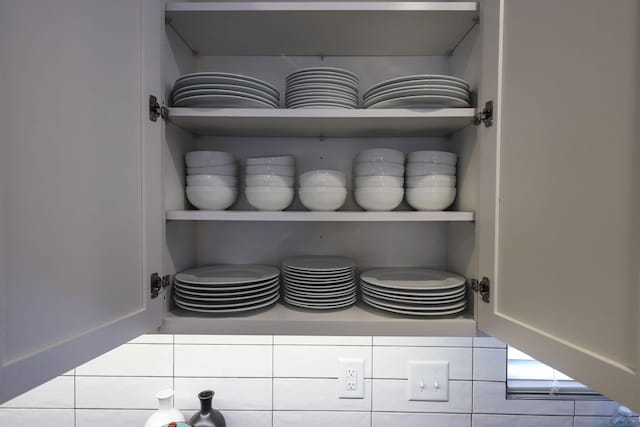 details featuring light countertops and open shelves