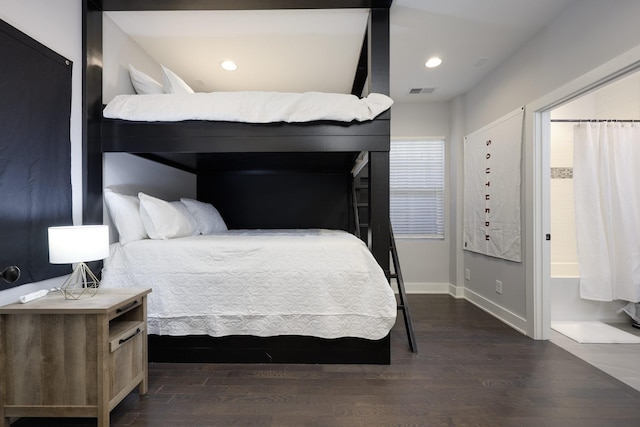 bedroom with recessed lighting, visible vents, dark wood finished floors, and baseboards