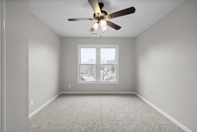 unfurnished room featuring ceiling fan, carpet flooring, and baseboards