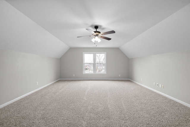 bonus room featuring carpet, baseboards, and vaulted ceiling