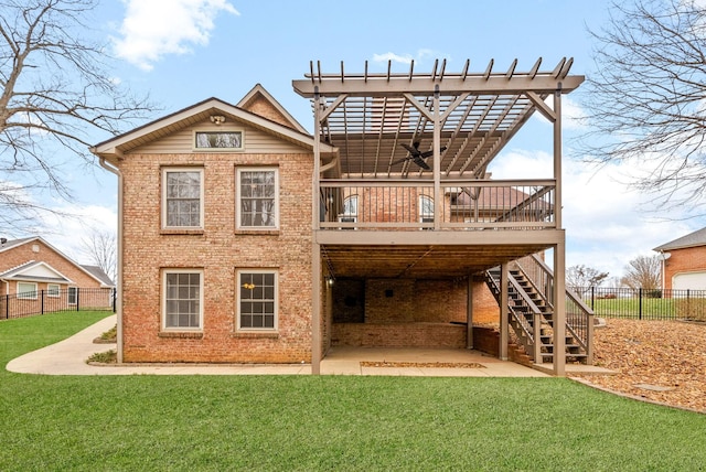 back of property featuring a yard, fence, a wooden deck, and stairs