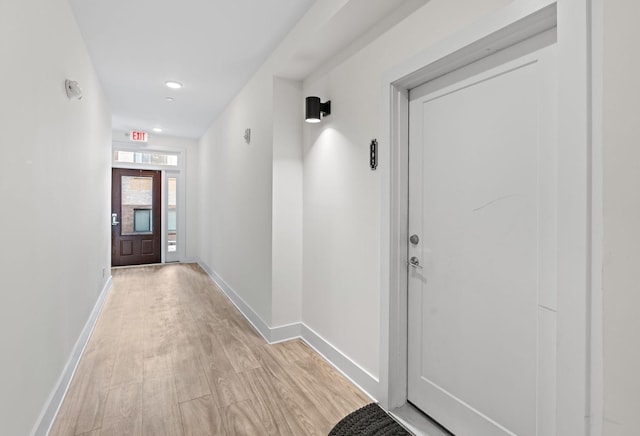 interior space with light wood-style flooring and baseboards