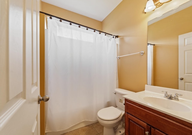 bathroom featuring vanity, toilet, and tile patterned floors