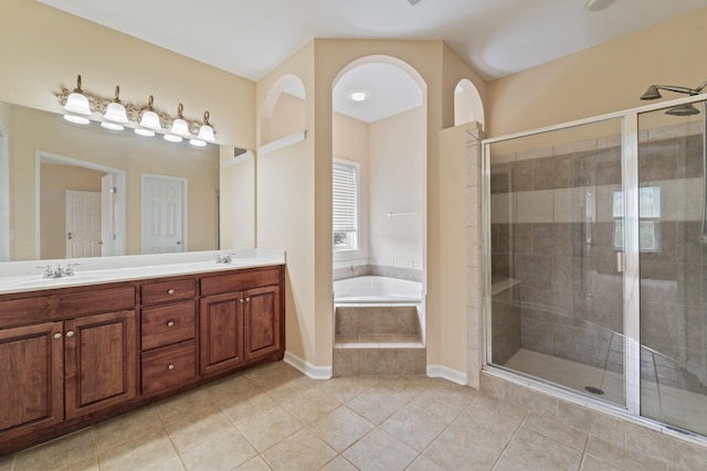 full bath featuring tile patterned floors, a shower stall, and a bath