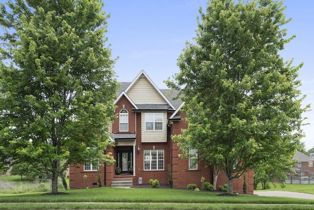 view of front of property featuring brick siding and a front lawn