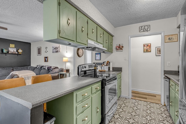 kitchen featuring a textured ceiling, under cabinet range hood, open floor plan, green cabinets, and appliances with stainless steel finishes