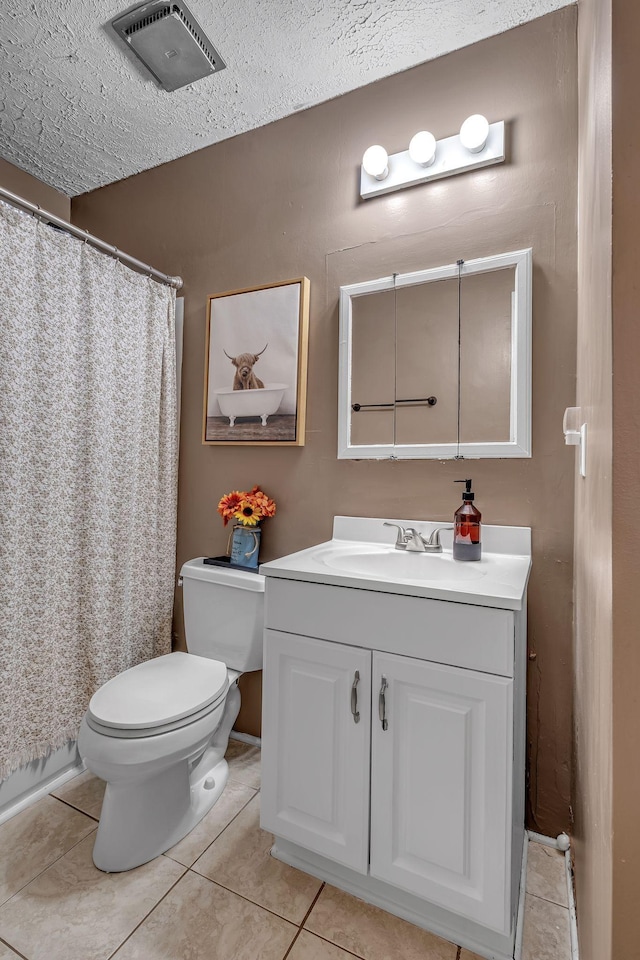 full bathroom featuring visible vents, vanity, toilet, and tile patterned floors